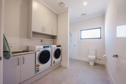 A laundry room with a washer and dryer.