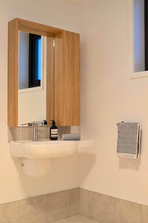 A bathroom sink with a mirror above it.