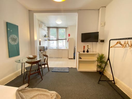 a living room with a table and a television