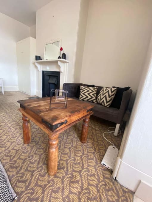 a living room with a coffee table and a couch