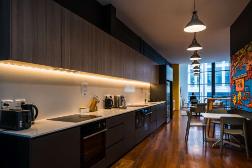a kitchen and dining area in a modern apartment