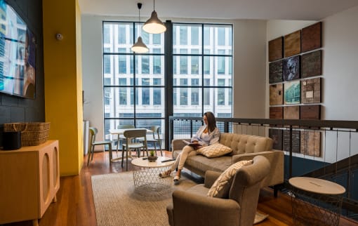 a woman sitting on a couch in a living room