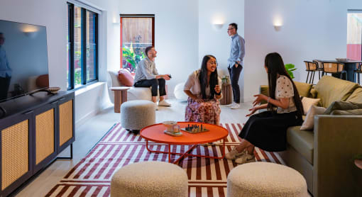 a group of people sitting in a living room