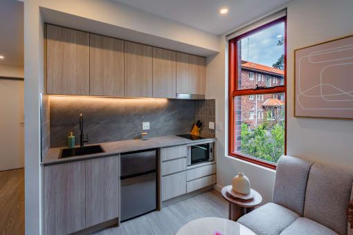 a small kitchen with a table and a window