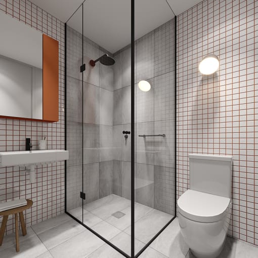 a white bathroom with a toilet and a shower