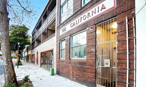 a brick building with a sign that reads the