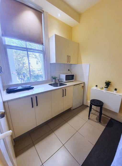 a kitchen with a sink and a window