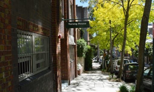 a street sign on the side of a brick building