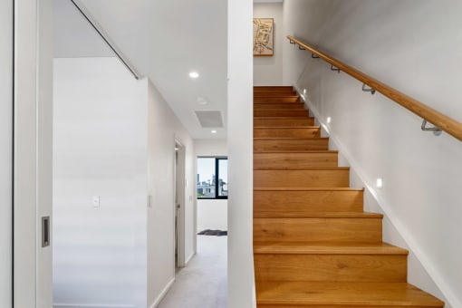 a set of stairs with white feathers on the floor