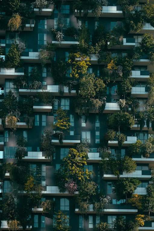 an image of a tall building with trees growing out of it
