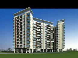 A modern multi-story residential building with balconies on each floor.
