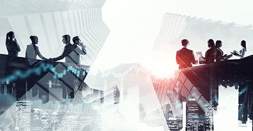 a group of people standing on top of a building