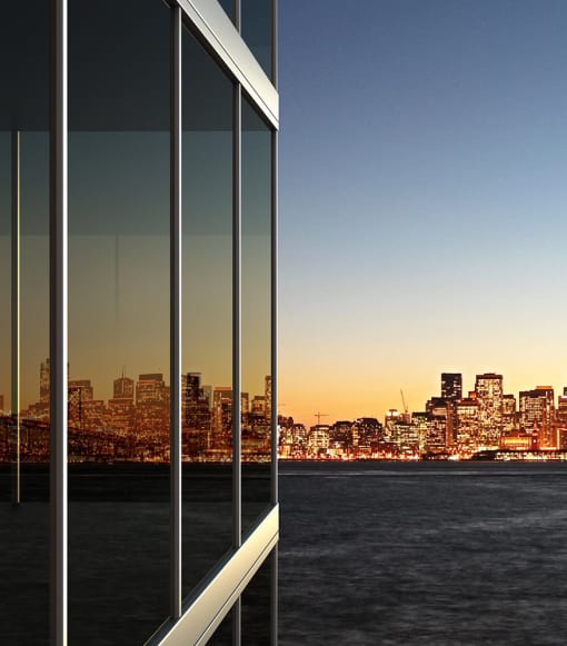 a reflection of the san francisco skyline in the windows of a building