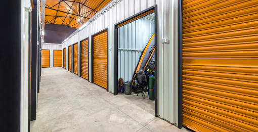 a row of yellow storage doors in a building