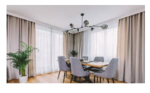 Dining room with wooden table and wooden floor