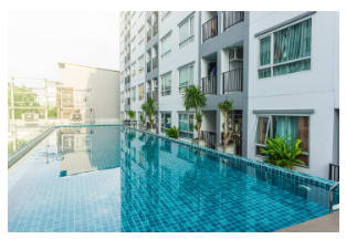 Luxurious swiming Pool surrounded with apartment buildings
