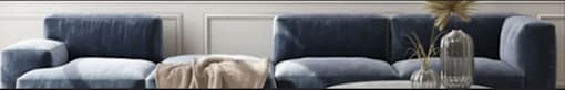 a blue chair sitting next to a white wall