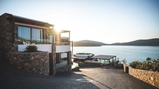 a house that is sitting next to a body of water