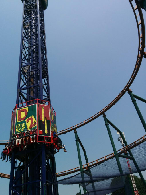 a roller coaster against a blue sky