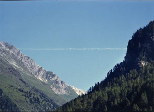 a view of a mountain range and a blue sky
