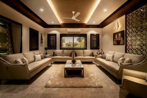 A well-lit, modern living room with a central coffee table and multiple seating options.