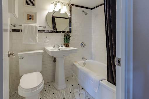 a bathroom with a toilet sink and bathtub