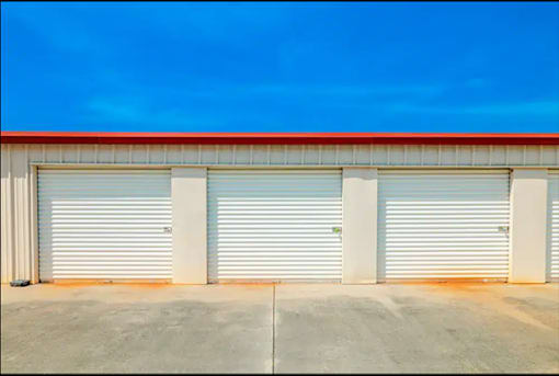 a row of garage doors on the side of a building