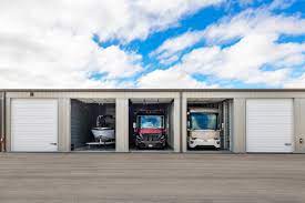 three cars parked in the front of a garage