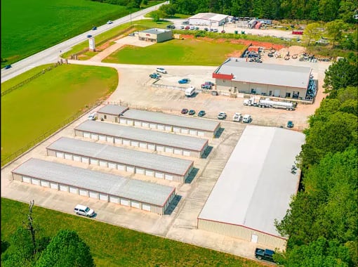 an aerial view of several buildings and a parking lot