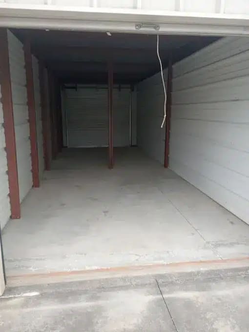 the inside of a garage with a white floor