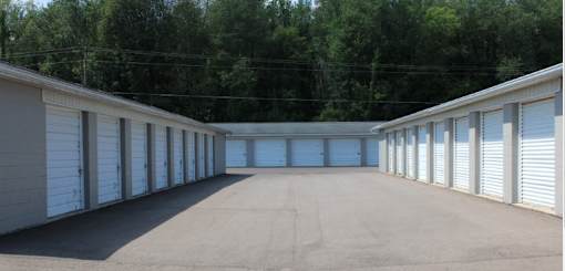 a row of garage doors in a parking lot