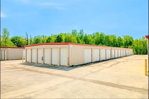 a row of storage units in a parking lot