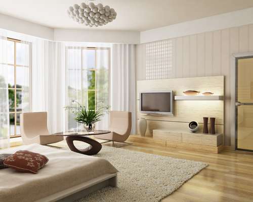 a bedroom with a bed and a tv