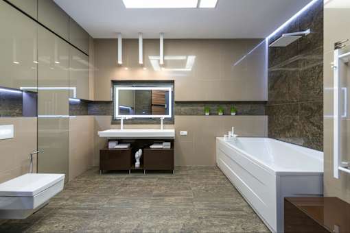 A modern bathroom with a walk-in shower, a bathtub, and a vanity.