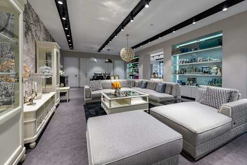 A modern furniture store with a variety of seating options.