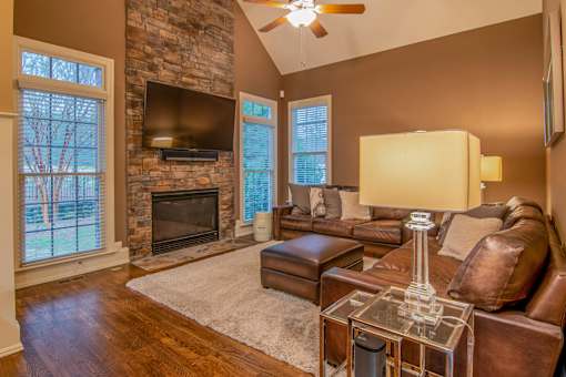 A living room with a fireplace and a couch.
