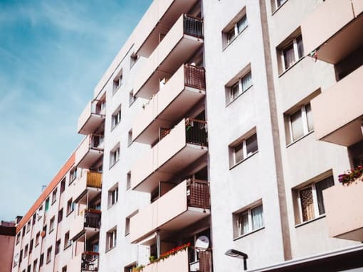 a large white building with many balconies