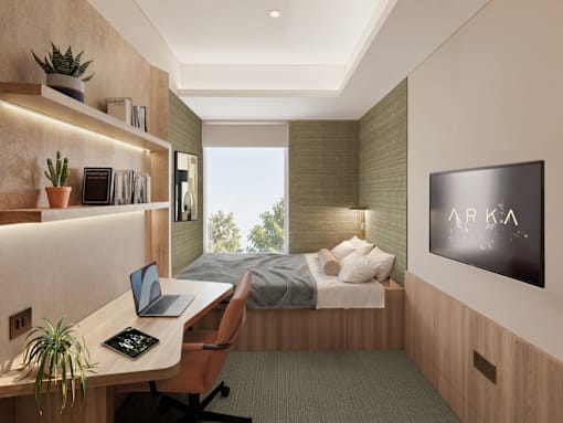 A modern bedroom with a desk and a flat screen TV mounted on the wall.
