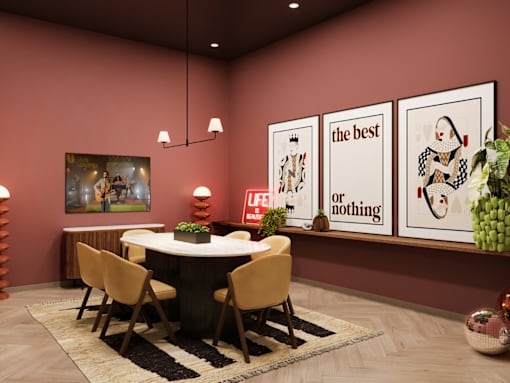 A dining room with a round table and chairs.