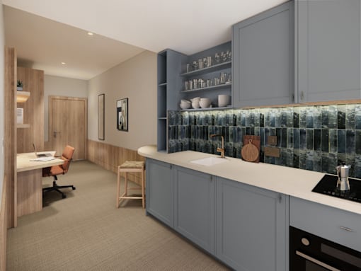 A kitchen with a blue backsplash and grey cabinets.