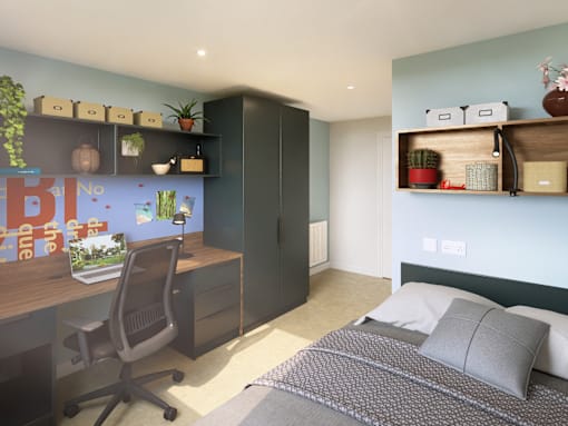 A bedroom with a bed, desk, and chair.