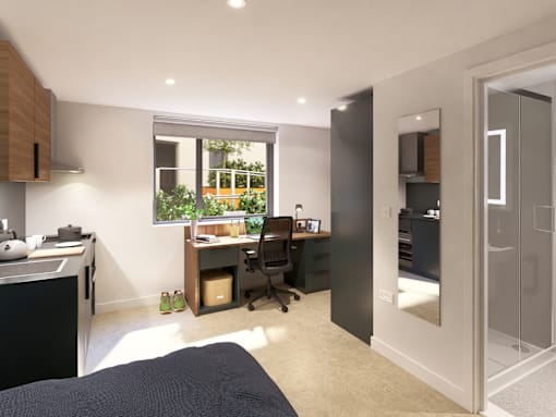 A modern bedroom with a desk and chair in the corner.