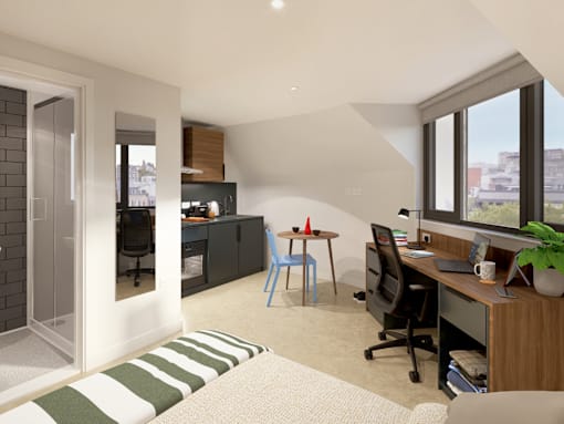 A modern home office with a desk, chair, and computer setup.