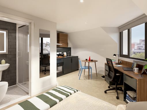 A modern home office with a desk, chair, and computer setup.