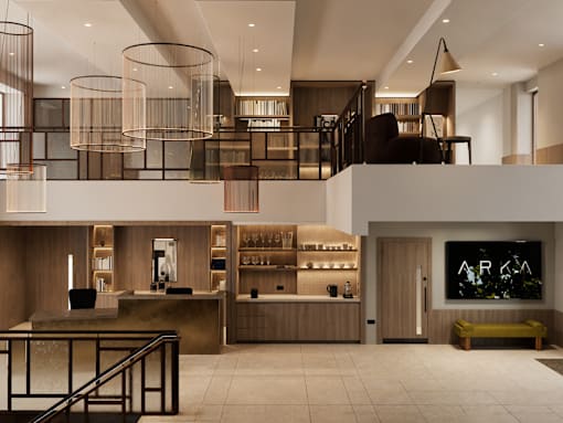 A modern interior space with a bar area and a staircase.