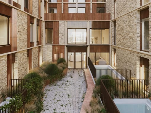 A courtyard with a brick pathway and a pool.
