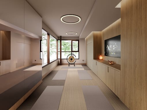 A modern hallway with a chair and a television mounted on the wall.