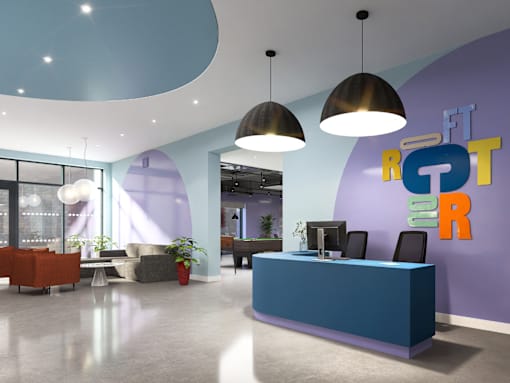 A reception area with a blue counter and a purple wall with the letters "FT" on it.