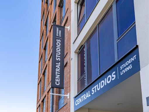 A sign for Central Studios Student Living is displayed on a building.