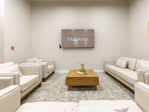A room with a sign that says Fitz&Knox on the wall.
